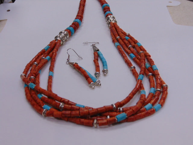 Single strand of Apple Coral in various shapes and sizes, there is also Silver and Turquoise beads. Matching earrings.
